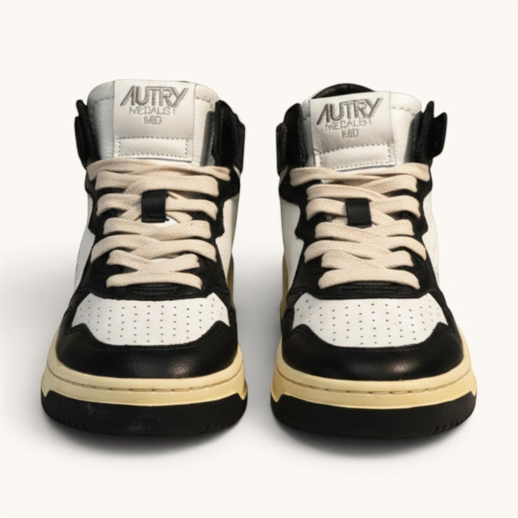 Numero 5 Autry black and white leather mid-top sneakers with perforated toe box and cream laces.