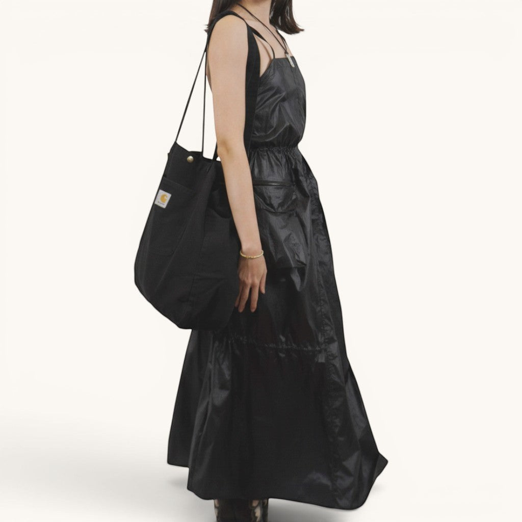 Numero 5 black polyester parachute dress with adjustable waist and pockets, perfect for summer.
