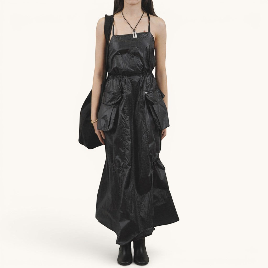 Numero 5 black polyester parachute dress with adjustable waist, pockets, and a midi length.
