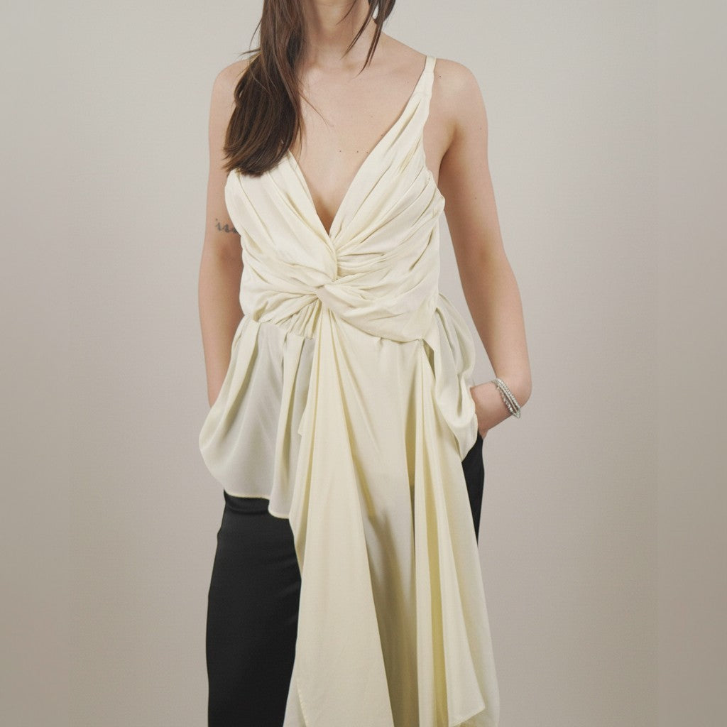 Numero 5 cream silk draped sleeveless top with deep V-neck and extended hem. Women's regular fit.