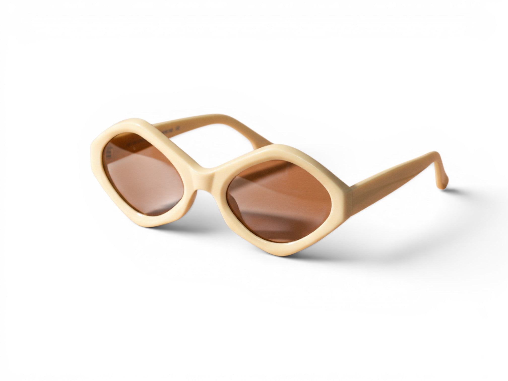 Numero 5 Kiko Kostadinov cream acetate sunglasses with brown lenses and unique diamond shape.