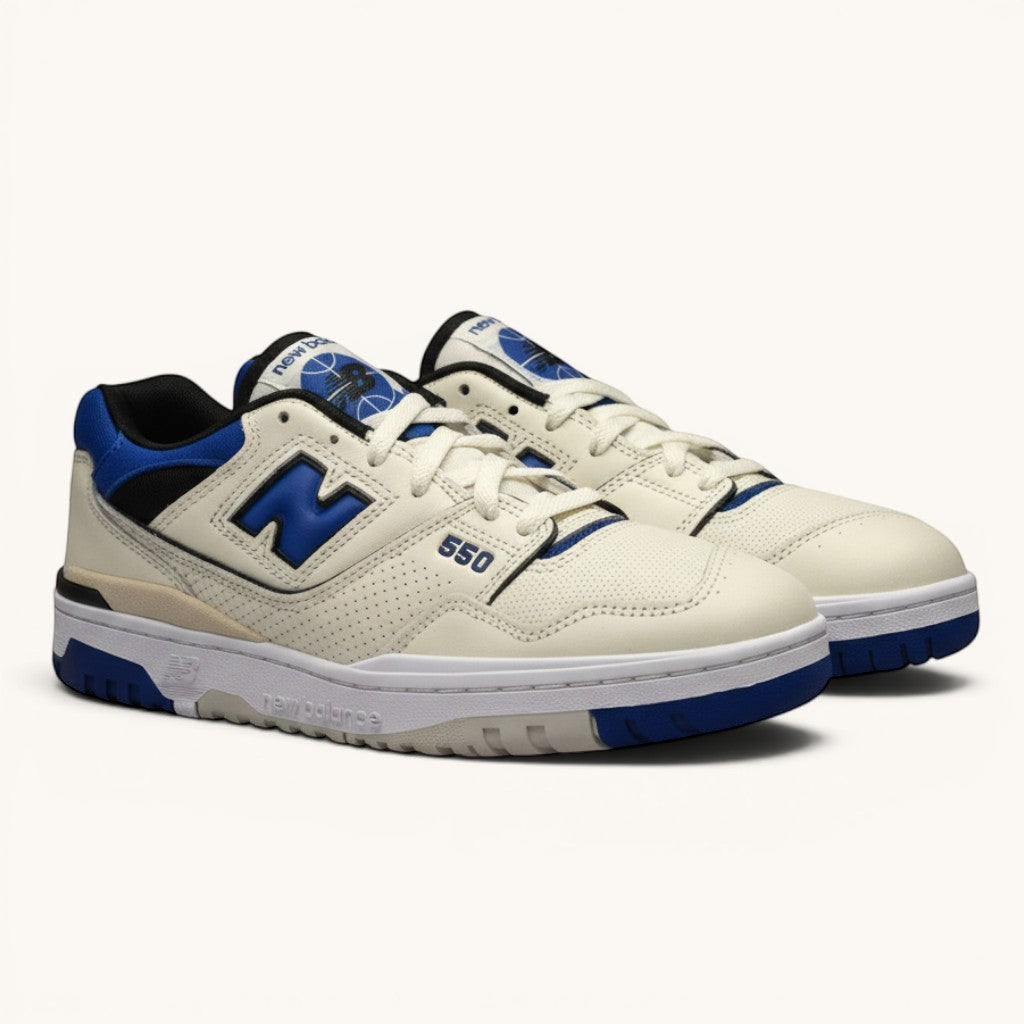Numero 5 New Balance 550 sneakers in cream leather with blue accents and white laces. Perforated toe box and side panels.