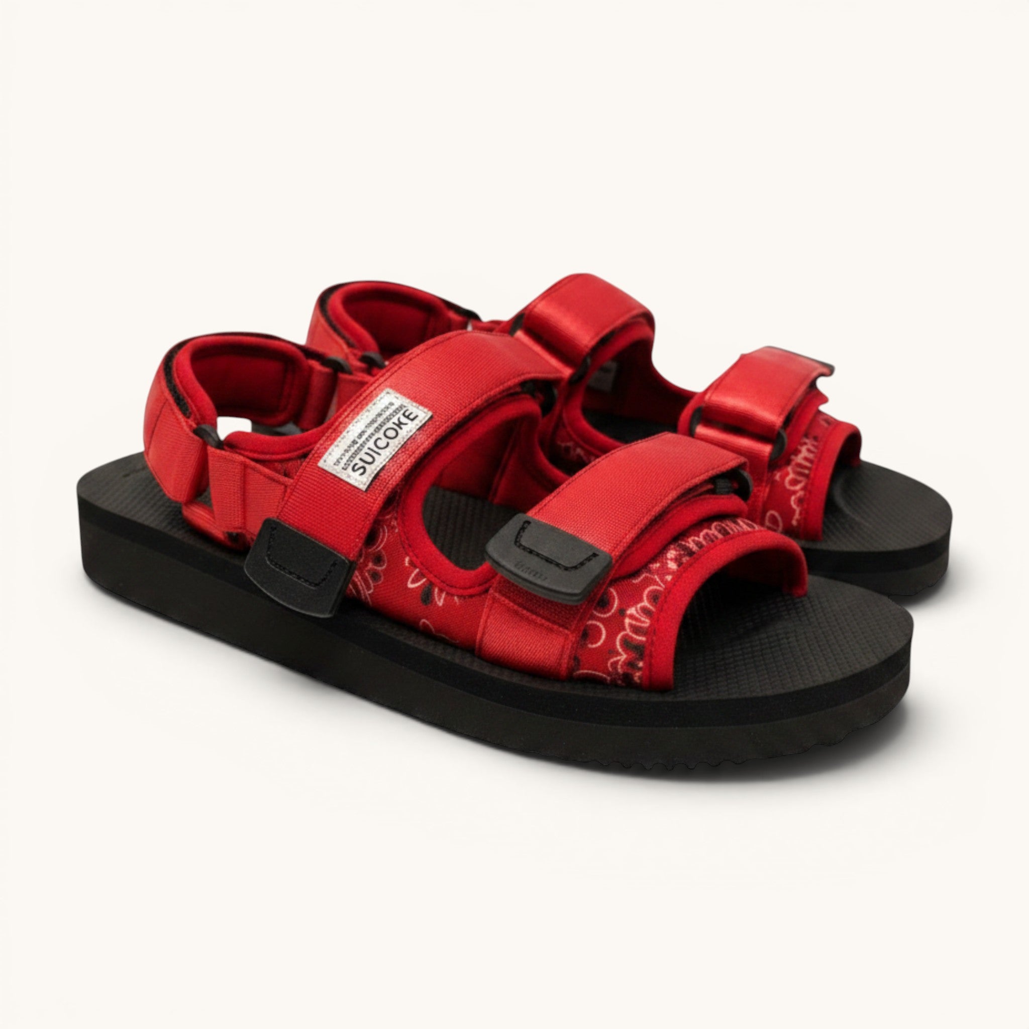 Numero 5 red bandana print adjustable strap sandals with black soles and hook-and-loop closures.