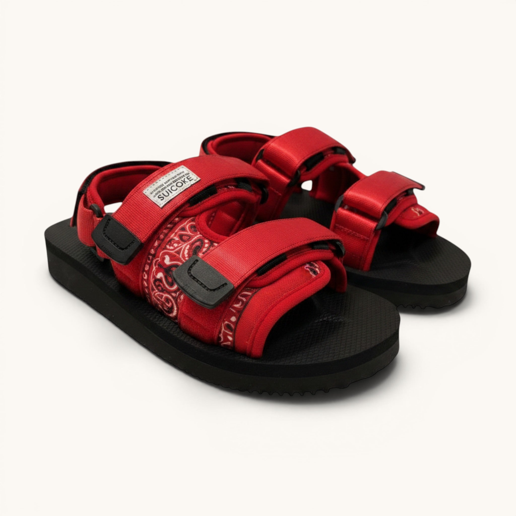 Numero 5 red bandana print adjustable strap sandals with black soles and hook-and-loop closures.