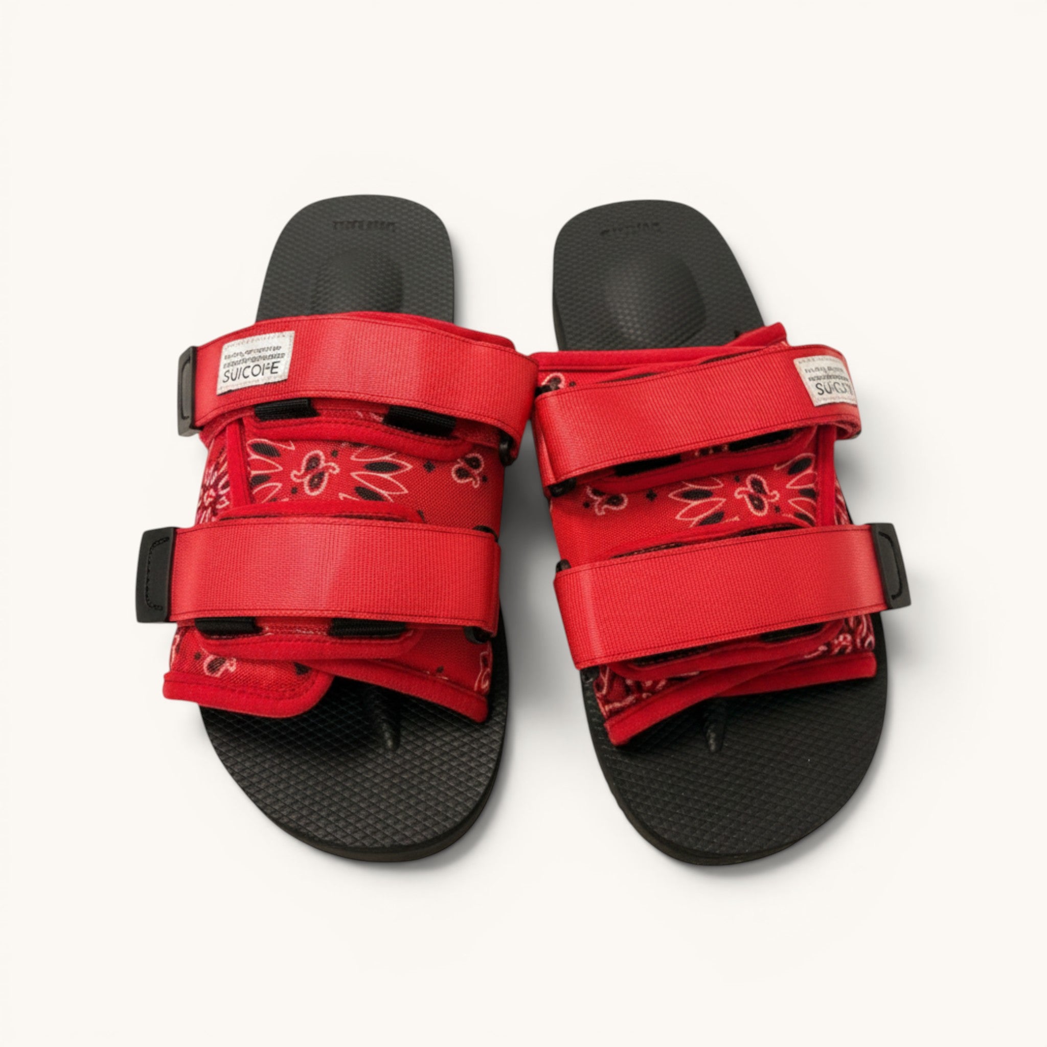 Numero 5 red bandana print adjustable strap sandals with black soles and hook-and-loop closures.
