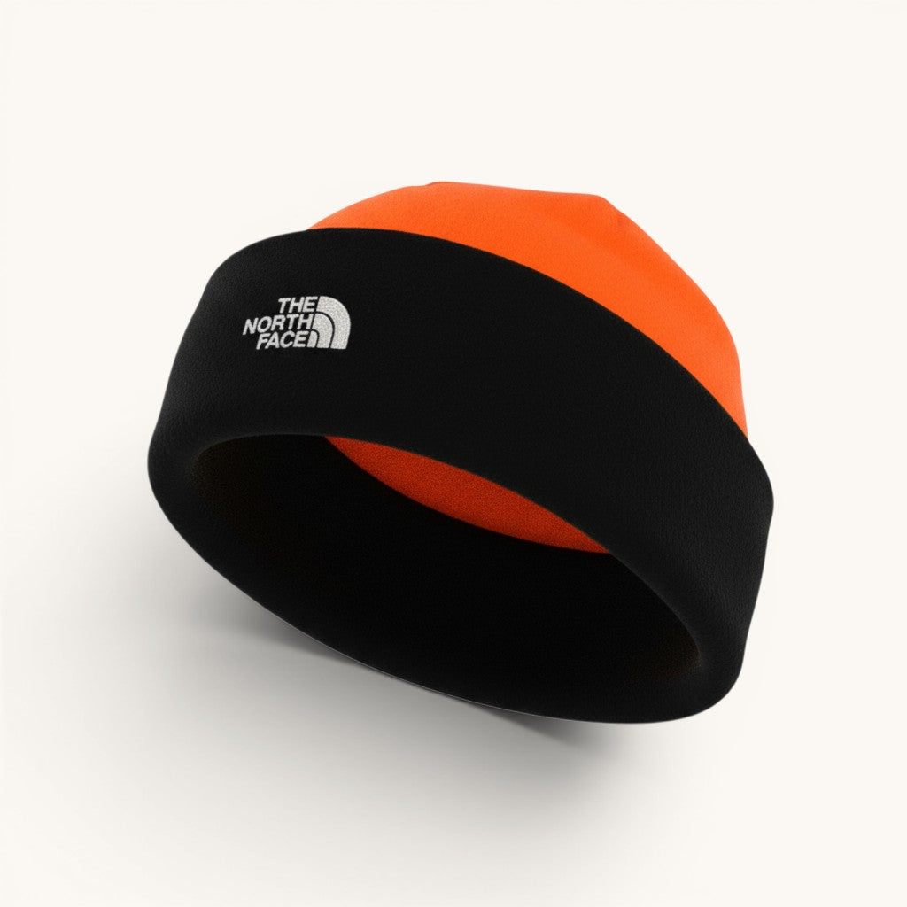 The North Face black and red-orange fleece beanie with embroidered logo. Suitable for men and all seasons.