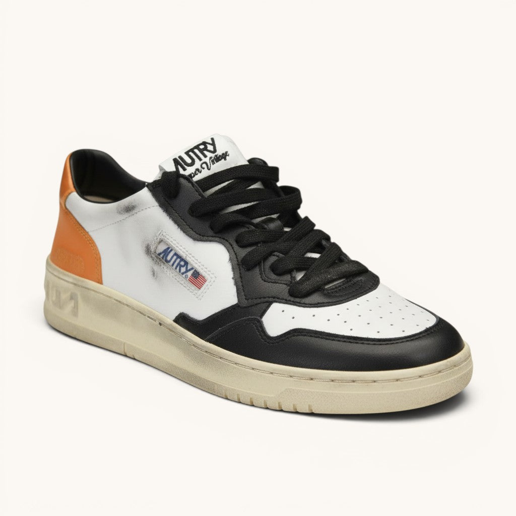 Numero 5 Autry white leather sneakers with orange heel detail and black laces. Features distressed detailing and logo patch.
