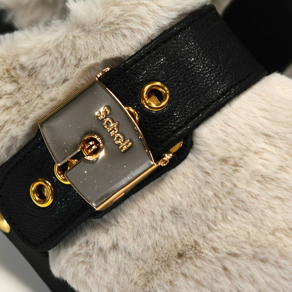Numero 5 women's black faux leather strap with gold buckle and eyelets on cream faux fur.
