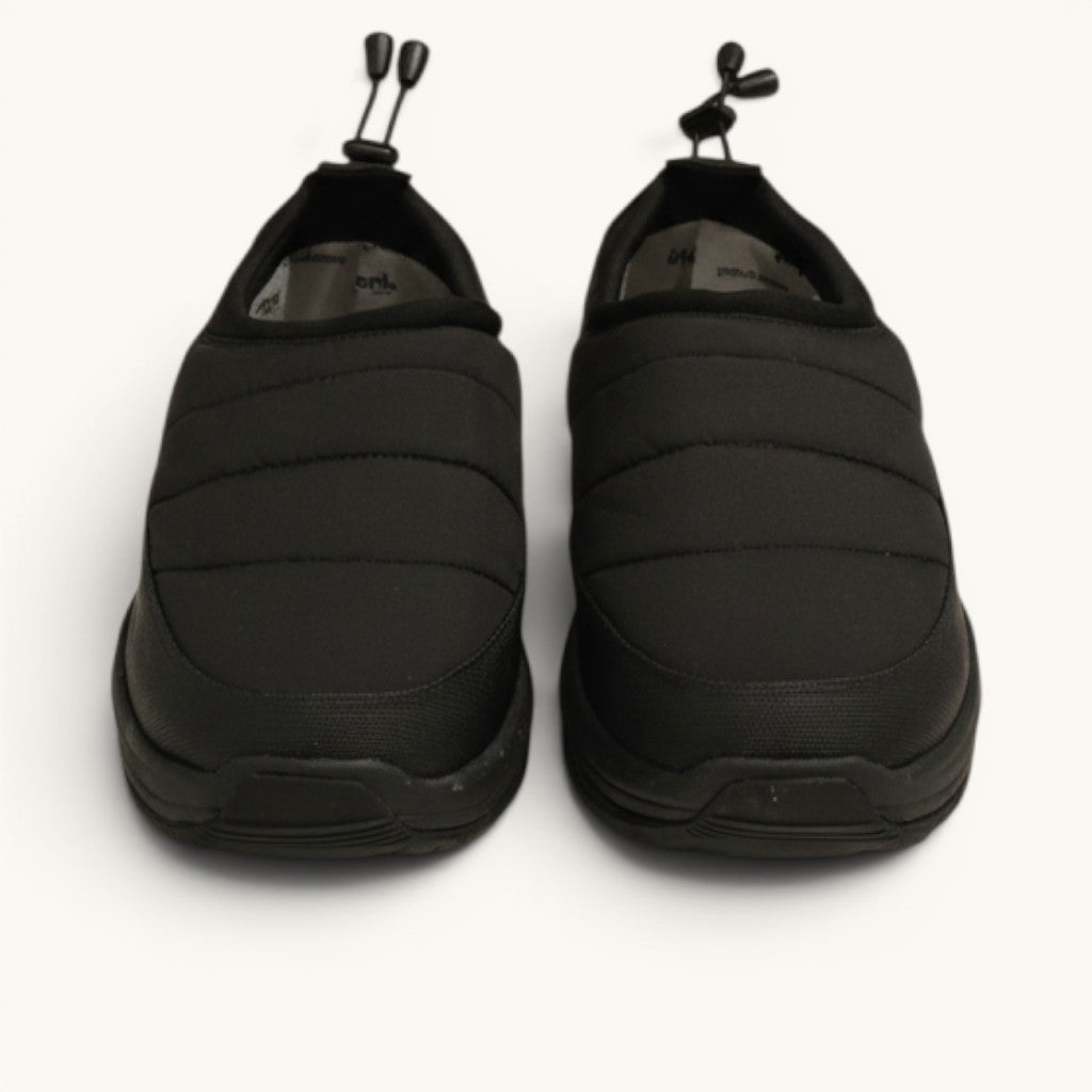 Numero 5 black quilted slip-on shoes with toggle drawstring and rubber sole.