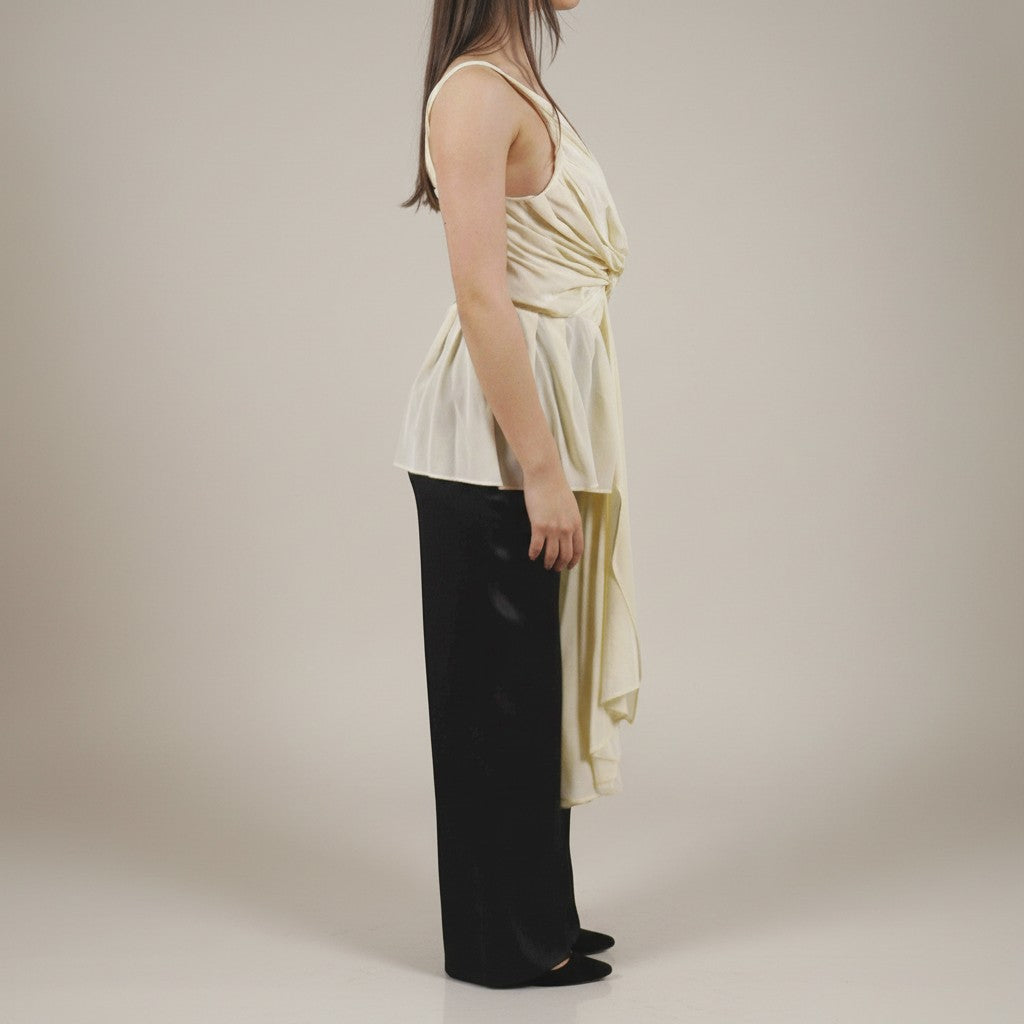 Numero 5 cream silk draped sleeveless top with asymmetric hem and knot detail.