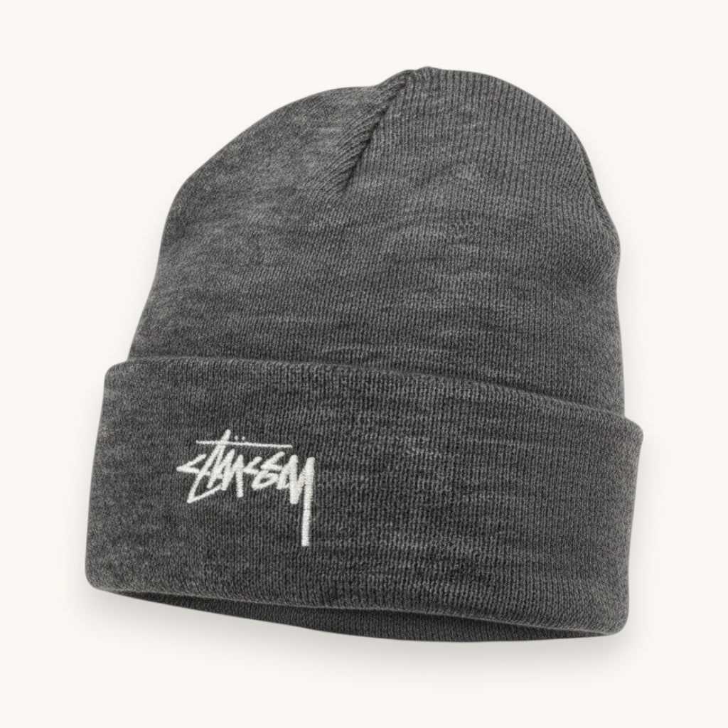 Numero 5 grey acrylic beanie with white Stussy logo embroidery. Streetwear style, one size fits all.