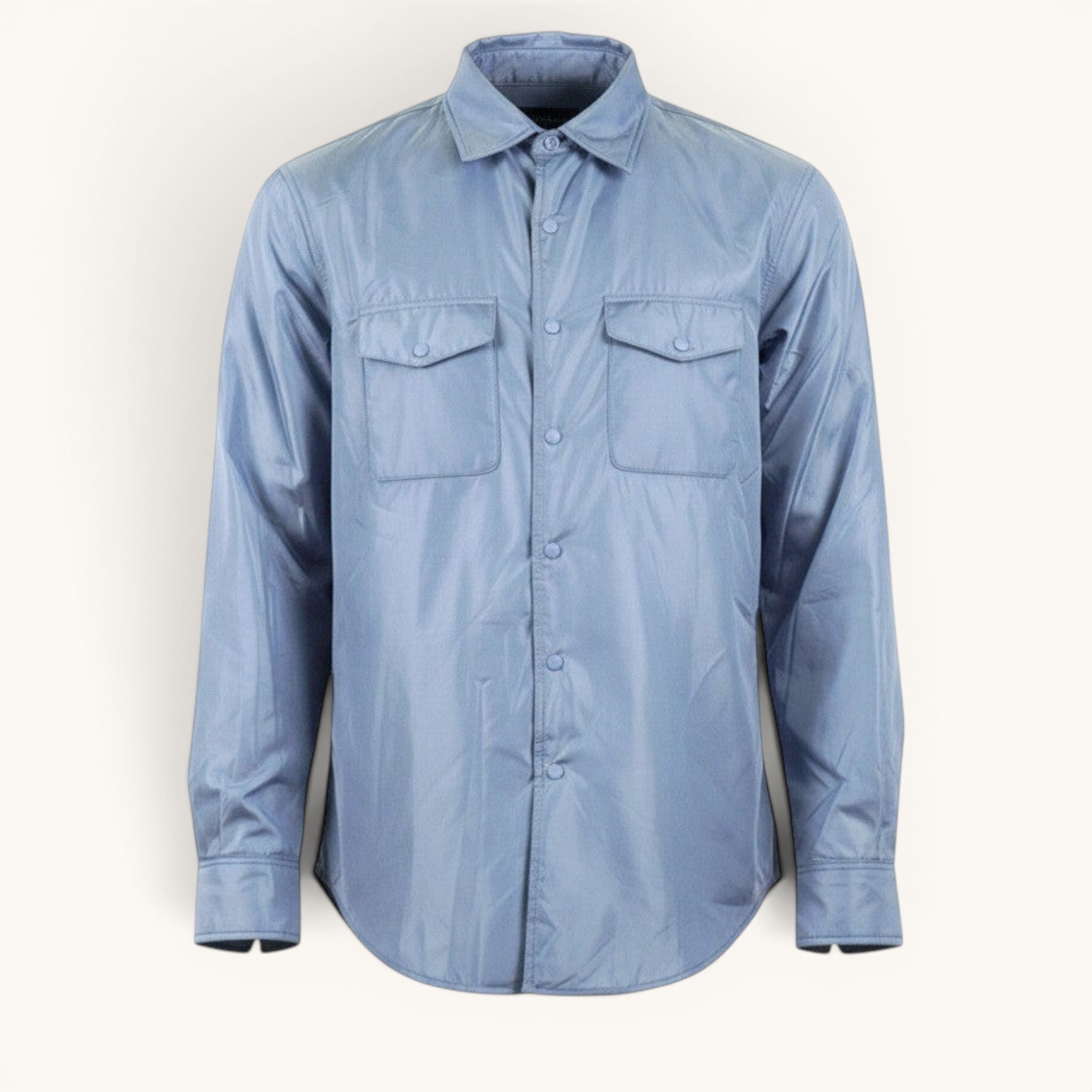 Numero 5 light blue nylon shirt with two chest pockets and button closure. Long sleeves with button cuffs.