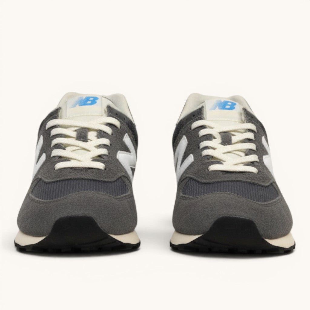 Numero 5 New Balance grey suede and mesh sneakers with white laces and blue NB logo.