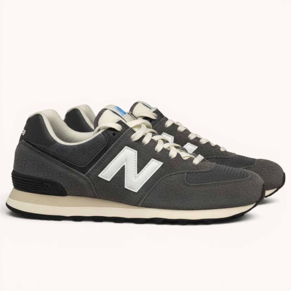 Numero 5 New Balance grey suede and mesh sneakers with white laces and blue NB logo.