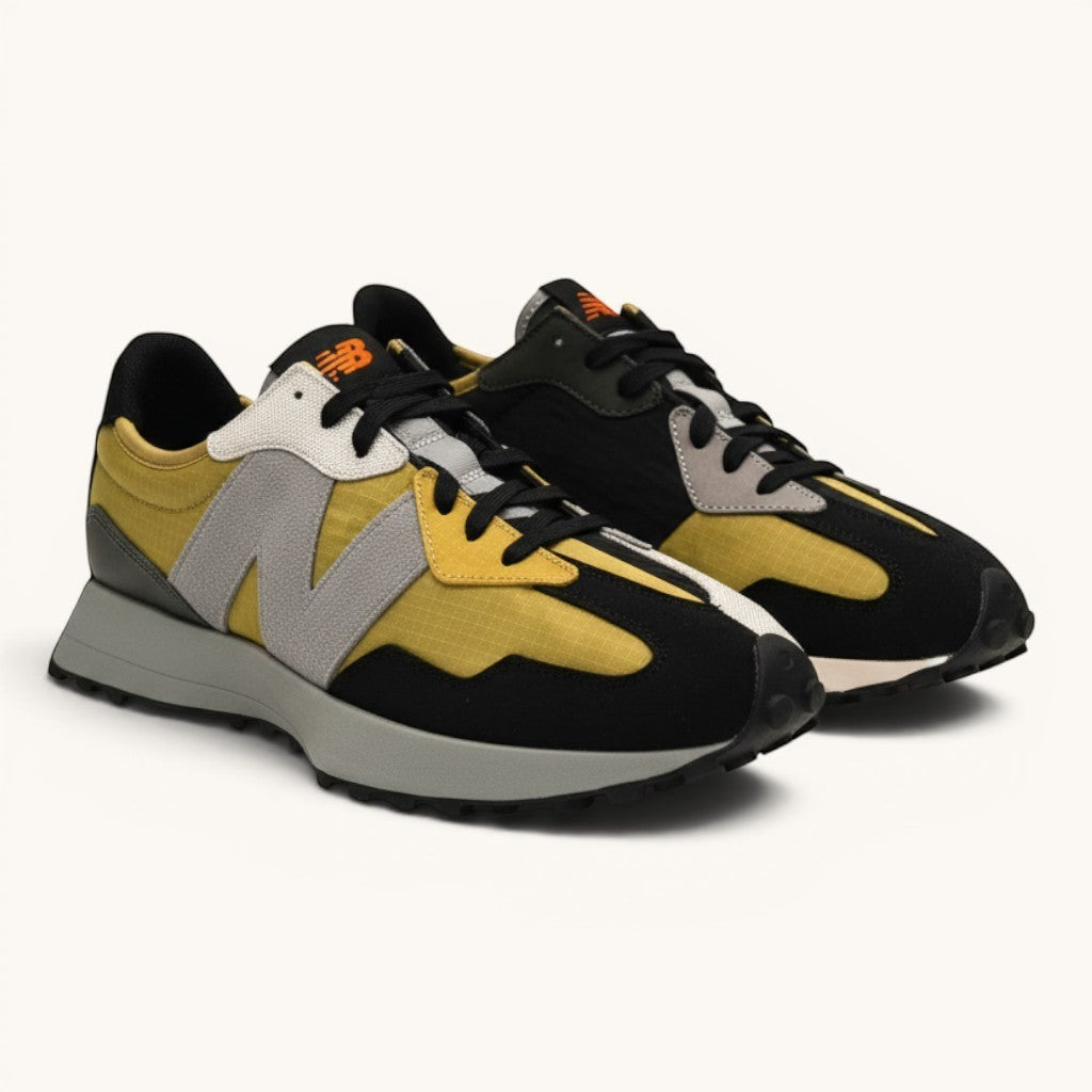 Numero 5 New Balance multicolor sneakers with grey suede N logo, yellow nylon, and black accents.