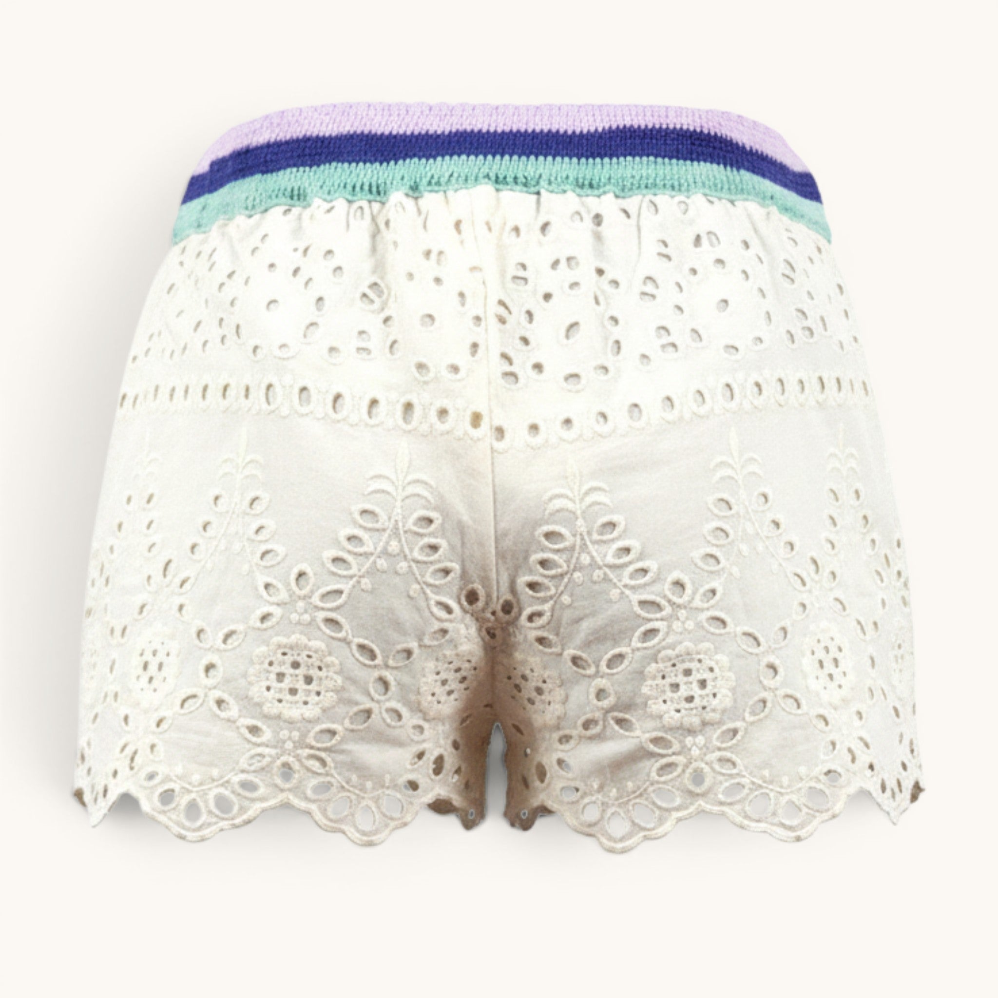 Numero 5 white cotton eyelet shorts with scalloped hem and striped elastic waistband.