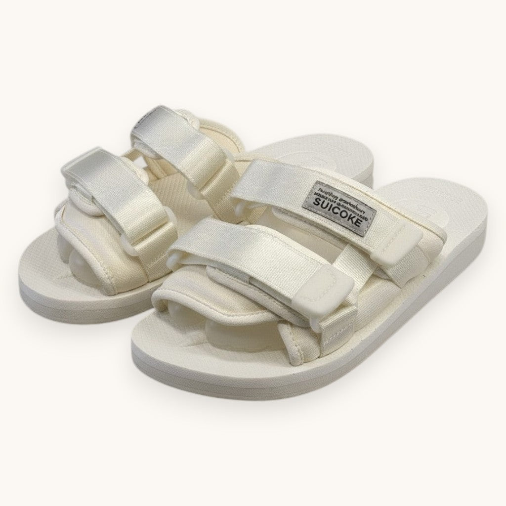 Numero 5 white Suicoke adjustable strap sandals with rubber sole and logo tag.