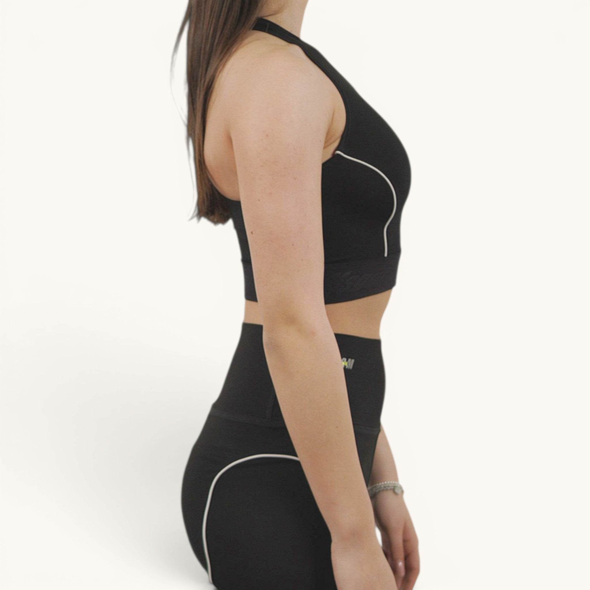 Numero 5 black polyamide-elastane sports top with white piping and MSGM active logo detail.