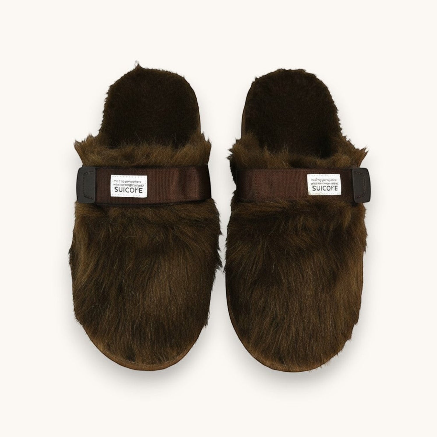 Numero 5 brown faux fur slip-on sandals with adjustable strap and Suicoke logo.