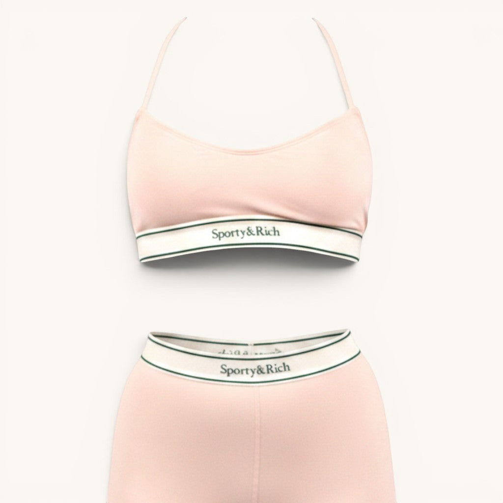 Numero 5 pink nylon-spandex biker shorts with white and green elastic waistband.