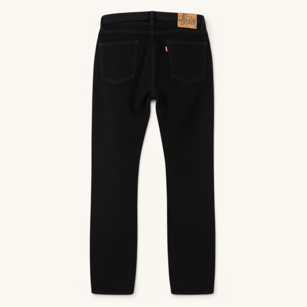 Numero 5 Stussy black corduroy jeans for men, 100% cotton, regular fit, durable for everyday wear.